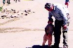 Tony Baldry MP meets a child in Malawi