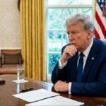 The White House Oval Office at night during the 2026 US-Iran crisis.